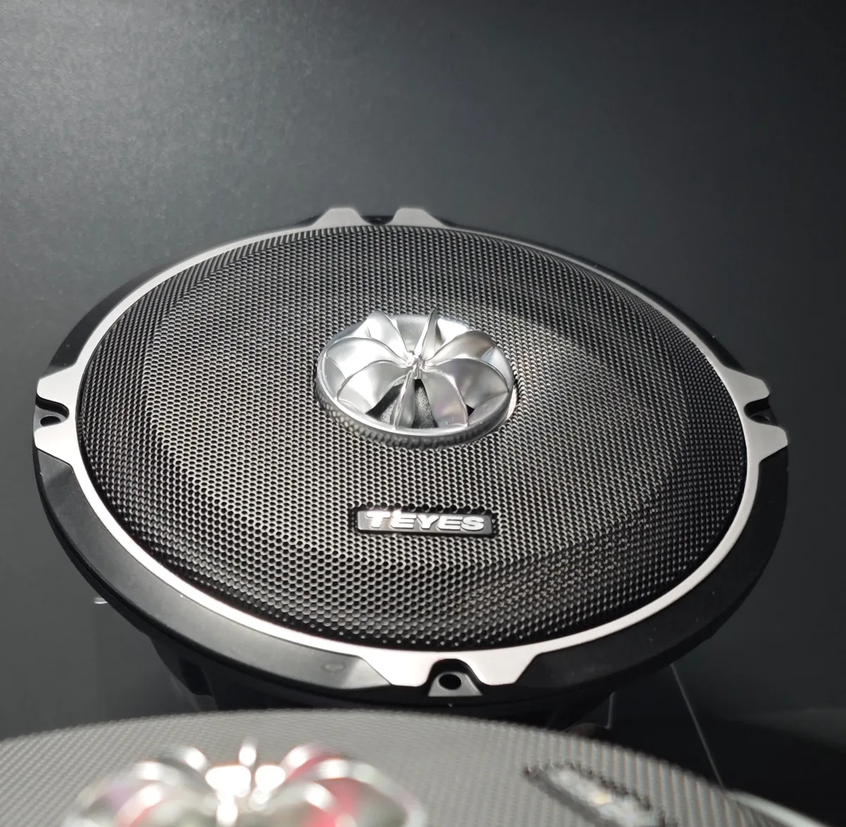 TEYES T6-652 6.5-inch speaker with metal mesh grille and multi-spoke tweeter at Automechanika Frankfurt 2026