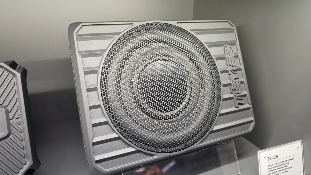 TEYES TS-08 under-seat enclosed subwoofer in die-cast aluminum housing at Automechanika Frankfurt 2026